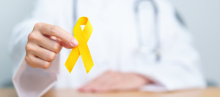 Yellow September, Suicide prevention day, Childhood, Sarcoma, bone and bladder cancer Awareness month, Yellow Ribbon for supporting people life and illness. Healthcare and World cancer day conceptの写真素材