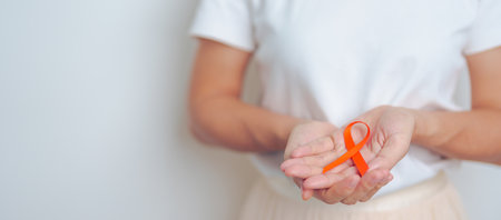 woman with Orange Ribbon for Leukemia, Kidney cancer day, world Multiple Sclerosis, CRPS, Self...