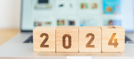 2024 Year block against marketplace website. Goal, Target, Resolution, finance, E commerce, online...