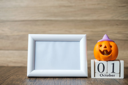 Orange pumpkin, 1 October calendar and frame with copy space for text. Happy Halloween day, Hello October, fall autumn season, Festive, party and holiday conceptの写真素材