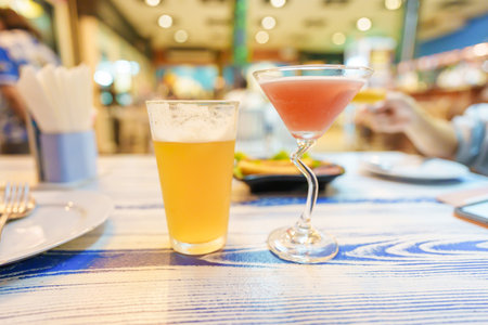 Draft Beer and Cocktail glass on table.  Party and celebration concept