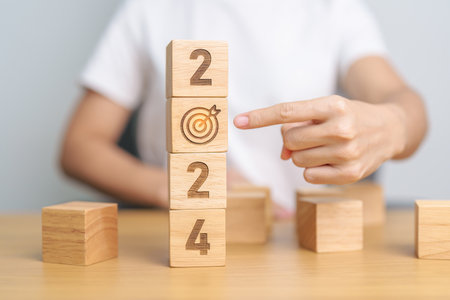 2024 block with dartboard sign. Business Goal, Target, Resolution, strategy, plan, Action...