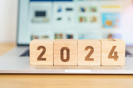 2024 Year block against marketplace website. Goal, Target, Resolution, finance, E commerce, online...