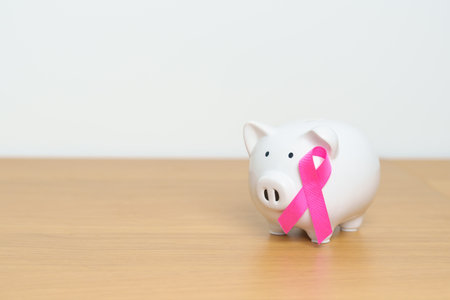 October Breast Cancer Awareness month, Pink Ribbon with Piggy Bank for support illness life. Health, Donation, Charity, Campaign, Money Saving, Fund, women day and World cancer day conceptの写真素材
