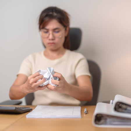 stressed Asian Woman with mistake paper, Tired female businesswoman working overload at office, Exhausted casual woman with documents folder stack at late night in home. Failure, Problem and businessの写真素材