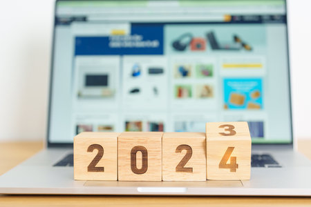 2024 Year block against marketplace website. Goal, Target, Resolution, finance, E commerce, online shopping, celebration and New Year start conceptsの写真素材
