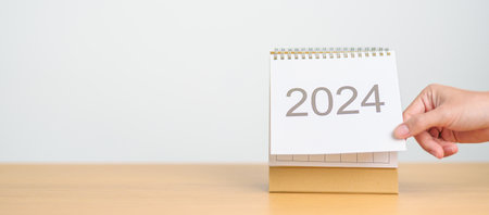 2024 Year Calendar on table background. Happy New Year, Resolution, Goals, Plan,  Action, Mission...