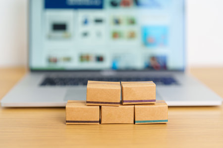 Boxes on laptop computer. online shopping, Marketplace platform website, technology, ecommerce, shipping delivery, logistics and online payment conceptsの写真素材