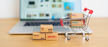 Shipping Boxes on laptop. Popular worldwide shipping and logistic company, Amazon, DHL, FedEx, UPS and OCS express delivery from online shopping. Bangkok, Thailand, 11 June 2023のeditorial素材