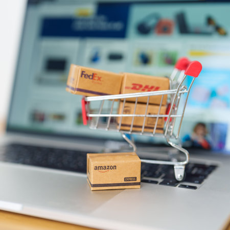 Shipping Boxes on laptop. Popular worldwide shipping and logistic company, Amazon, DHL, FedEx, UPS and OCS express delivery from online shopping. Bangkok, Thailand, 11 June 2023のeditorial素材