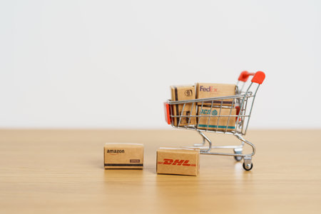 Shipping Boxes on laptop. Popular worldwide shipping and logistic company, Amazon, DHL, FedEx, UPS and OCS express delivery from online shopping. Bangkok, Thailand, 11 June 2023のeditorial素材