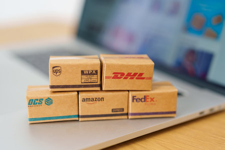 Shipping Boxes on laptop. Popular worldwide shipping and logistic company, Amazon, DHL, FedEx, UPS and OCS express delivery from online shopping. Bangkok, Thailand, 11 June 2023のeditorial素材