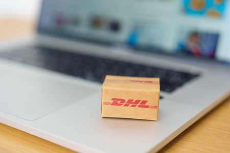DHL express Shipping Box on laptop, Popular worldwide shipping and logistic company. Bangkok,...