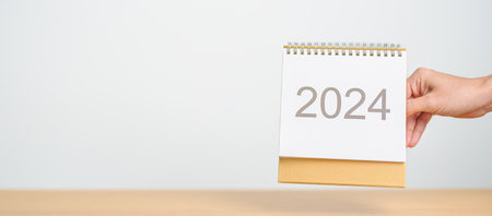 2024 Year Calendar on table background. Happy New Year, Resolution, Goals, Plan,  Action, Mission...