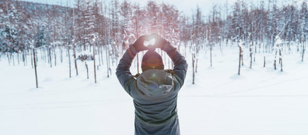 Woman tourist Visiting in Biei, Traveler in Sweater sightseeing Blue Pond with Snow in winter....