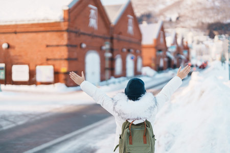 Woman tourist Visiting in Hakodate, Traveler in Sweater sightseeing Kanemori Red Brick Warehouse...