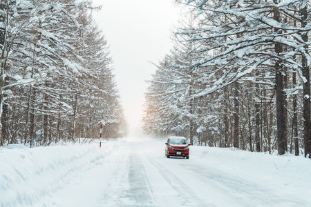 Beautiful snow road forest view during car driving in winter season. Winter travel, Road trip, Adventure, Exploring and Vacation conceptsの写真素材