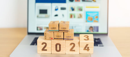 2024 New Year Online Shopping concept. Shipping Boxes on laptop computer. Sale and discount during Christmas and New Year holiday, ecommerce, shipping delivery, logistics and Cyber Mondayの写真素材