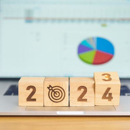 2024 Year block with dartboard icon against computer laptop background. Goal, Target, Resolution,...