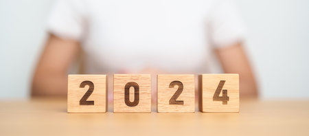 2024 year block on table. goal, Resolution, strategy, plan, start, budget, mission, action, motivation and New Year conceptsの写真素材