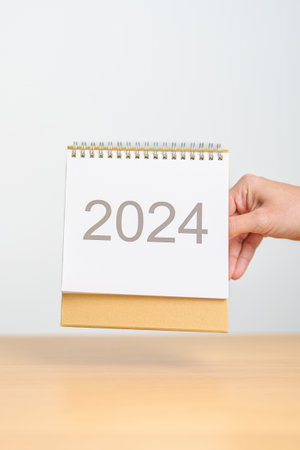 2024 Year Calendar on table background. Happy New Year, Resolution, Goals, Plan,  Action, Mission...