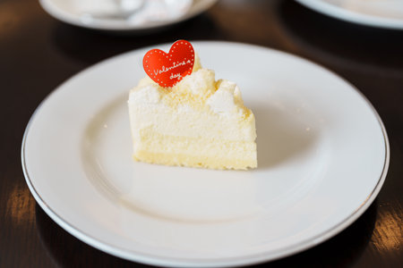 Homemade Cheese Cake with fresh strawberries and hot Tea cup. Dessert and beverage for Happy Valentine Day celebrationの写真素材