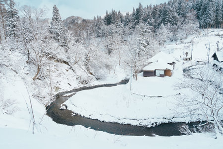 Beautiful view of Ginzan Onsen village with snow fall in winter season is most famous Japanese Hot Spring in Yamagata, Japan.の写真素材