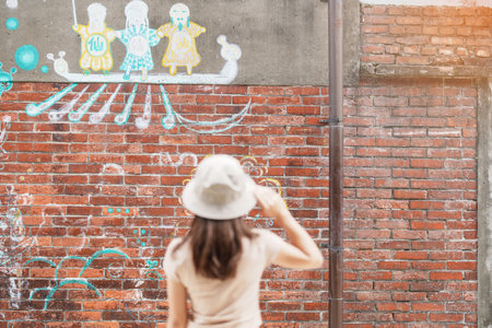 woman traveler visiting in Taiwan, Tourist with backpack and hat sightseeing in Bopiliao Historic Block, landmark and popular attractions in Taipei city. Asia Travelの写真素材
