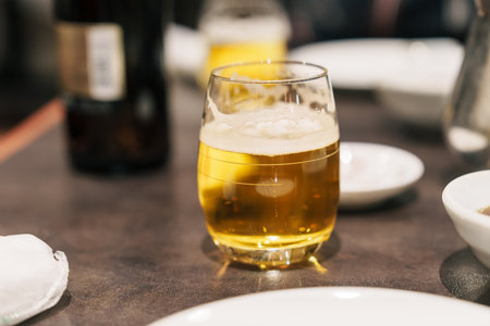 draft beer glass on table at restaurantの写真素材
