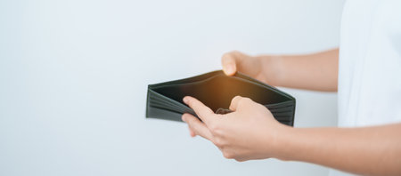 Woman hand holding and open empty wallet with not have banknote money. Crisis, loan, bankrupt and...