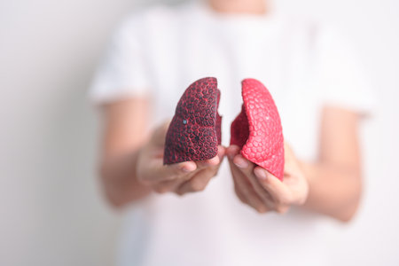 woman hold Smoker anatomy for Disease. Lung Cancer, Asthma, Chronic Obstructive Pulmonary or COPD, Bronchitis, Emphysema, Cystic Fibrosis, Bronchiectasis, Pneumonia and world Lung day conceptの写真素材