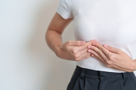 Woman having liver pain. Liver cancer and Tumor, Jaundice, Viral Hepatitis A, B, C, D, E, Cirrhosis, Failure, Enlarged, Hepatic Encephalopathy, Ascites Fluid in Belly and healthの写真素材