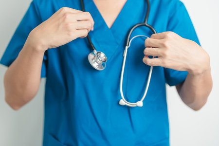 Healthcare and medical concept. doctor hand hold stethoscope in hospital. Health background, wellness and Insuranceの写真素材