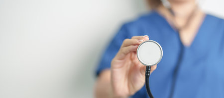 Healthcare and medical concept. doctor hand hold stethoscope in hospital. Health background, wellness and Insuranceの写真素材
