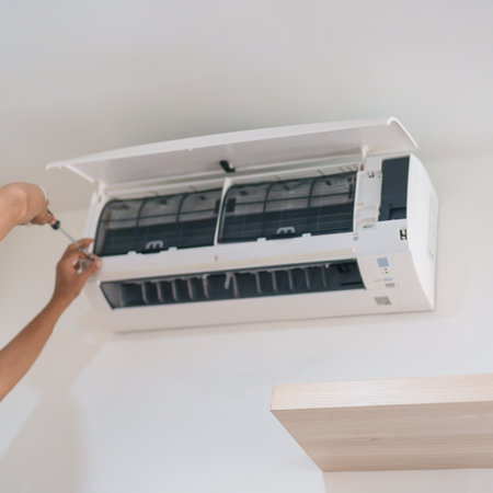 Man technician maintenance air conditioner. Purification system for cleaning dust PM2.5 and virus in home. Repair, Washing, Conditioning Service, Allergy, Pure air, health, Wellness and Air Pollutionの写真素材