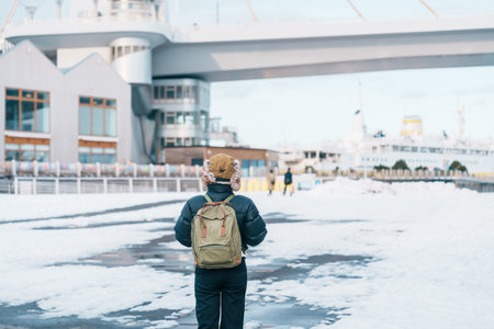 Woman tourist sightseeing Aomori Bay Bridge area, Traveler travel in Aomori city, Aomori Prefecture, Japan. Landmark for tourist attraction, travel and vacationの写真素材