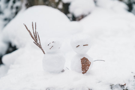 Happy snowman in winter christmas landscape forest. Merry christmas and happy new year greeting card and Snow backgroundの写真素材