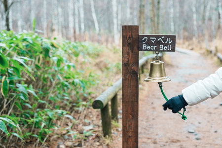 Woman tourist travel Kamikochi National Park, happy Traveler with Bear bell in the forest, Nagano Prefecture, Japan. Landmark for tourists attraction. Japan Travel, Destination and Vacationの写真素材