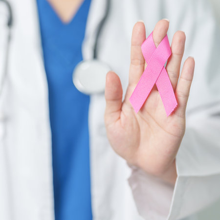 Pink October Breast Cancer Awareness month, woman doctor with pink Ribbon in hospital for support people life and illness. National cancer survivors month, Mother and World cancer day conceptの写真素材