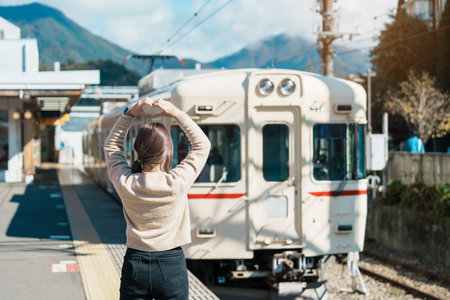 Woman tourist with local train at Otsuki station during trip to Kawaguchiko station, happy Traveler sightseeing Mount Fuji in Yamanashi, Japan. Japan Travel, Destination and Vacation concceptの写真素材