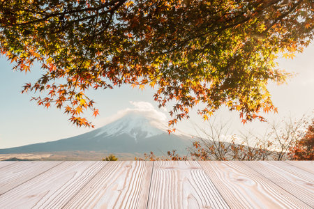 Empty wood table mockup with Mount Fuji view at Kawaguchiko lake background and copy space for text, Mock up for your product display and montage in autumn season. Japan travel and vacation conceptの写真素材