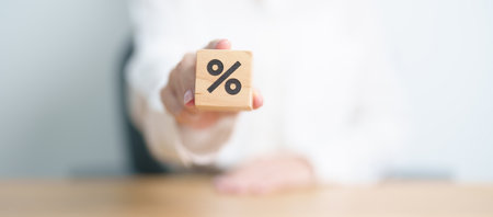 Wood Block of Percentage symbol. Interest rate, GDP, stocks market, financial, deflation and Inflation, mortgage, debt, Loan and Economic Recession conceptの写真素材
