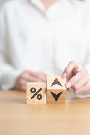 wood block of percentage change to UP and Down arrow. Interest rate, GDP, stocks market, financial, deflation and Inflation, ranking, mortgage, debt, Loan and Economic Recession conceptの写真素材