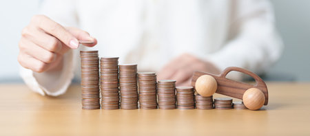 Money Saving, Car Insurance, Financial, vehicle Repair and Maintenance concepts. coins stack and piggy bank with Auto model, Money stack Counting arrangement for deposit and Automobile Taxの写真素材