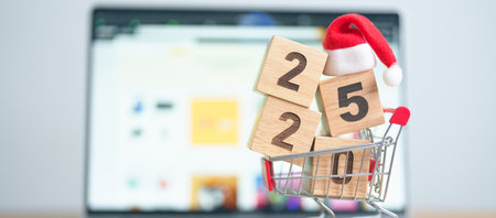 Christmas Online Shopping and Happy new year with 2025 block concept. Boxes with shopping cart on a...