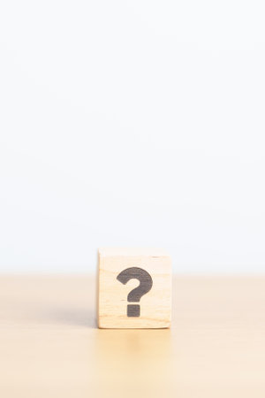 Wood block of Questions Mark ( ? ) sign. FAQ, frequency asked questions, Answer, Q and A,...
