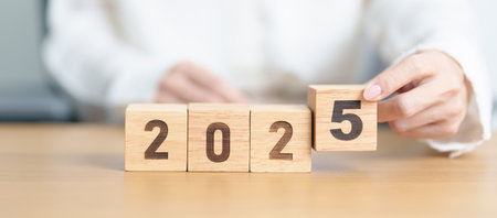 2025 year calendar block on table. goal, Resolution, strategy, plan, start, budget, mission, action, motivation and New Year conceptsの写真素材