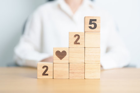 Happy New Year 2025 with heart block for health care, love, organ donation, resolution, charity, happy family, wellbeing and insurance conceptsの写真素材