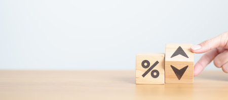 wood block of percentage change to UP and Down arrow. Interest rate, GDP, stocks market, financial,...