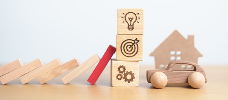 wood block falling to business icon with Home and Car model. Real estate Mortgage, House loan and...